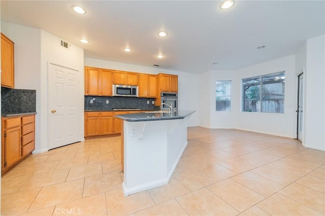 kitchen with light tile patterned floors, visible vents, appliances with stainless steel finishes, and recessed lighting