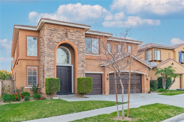 view of front of home featuring a garage, stone siding, concrete driveway, stucco siding, and a front yard