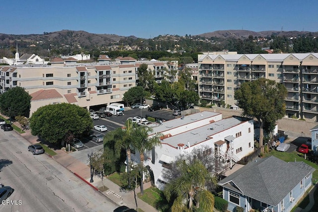 birds eye view of property featuring a mountain view