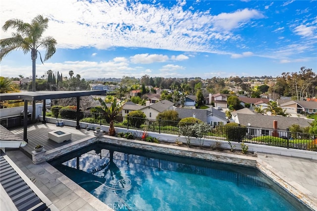 view of pool featuring a fenced in pool, a residential view, and fence