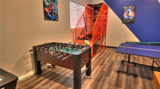 game room featuring wood finished floors and baseboards