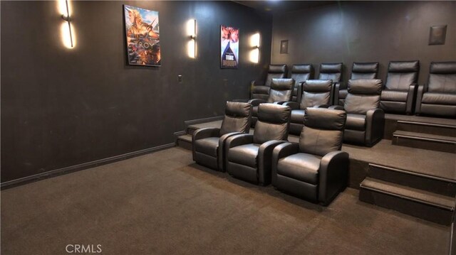 cinema with baseboards and carpet