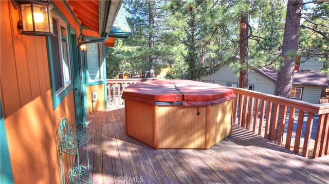 deck with a hot tub