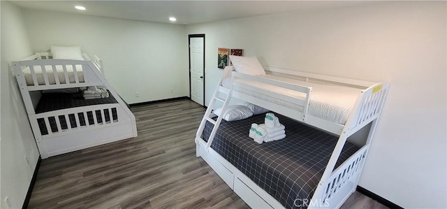 bedroom with recessed lighting, baseboards, and wood finished floors