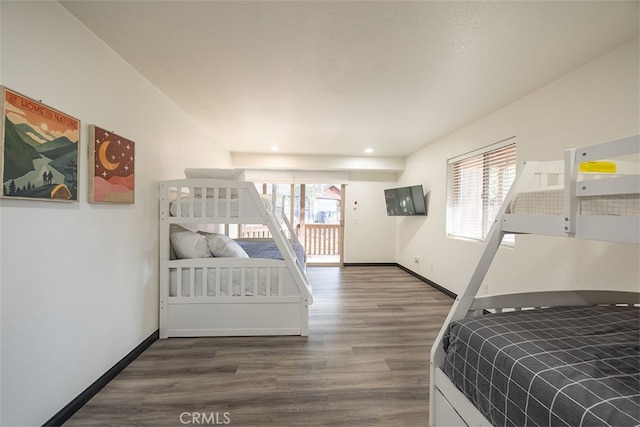 bedroom with dark wood-style flooring, baseboards, and recessed lighting