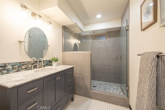 full bath featuring a stall shower, vanity, and recessed lighting
