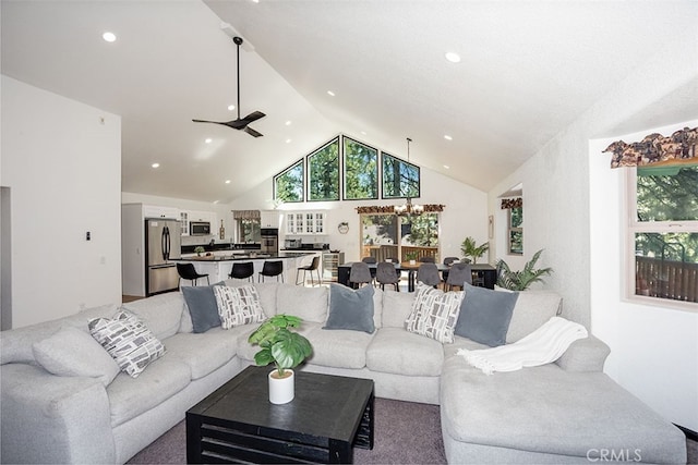 living area featuring a ceiling fan, high vaulted ceiling, and recessed lighting