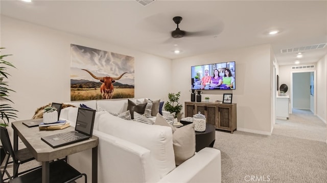 home theater featuring recessed lighting, light carpet, visible vents, a ceiling fan, and baseboards