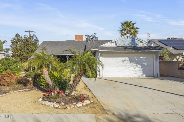 single story home with stucco siding, driveway, an attached garage, and fence