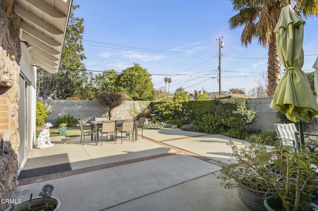 view of patio / terrace with outdoor dining area and a fenced backyard