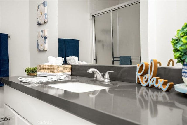 room details with vanity and a shower stall