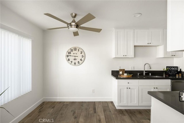700 W La Veta Ave Unit I11, Orange, CA 92868 - kitchen featuring a sink, dark countertops, ceiling fan, and baseboards
