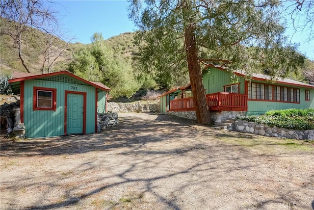 exterior space with a shed and an outdoor structure