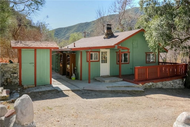 view of shed featuring a mountain view