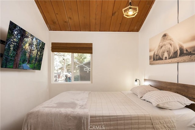 bedroom featuring lofted ceiling, ornamental molding, and wooden ceiling