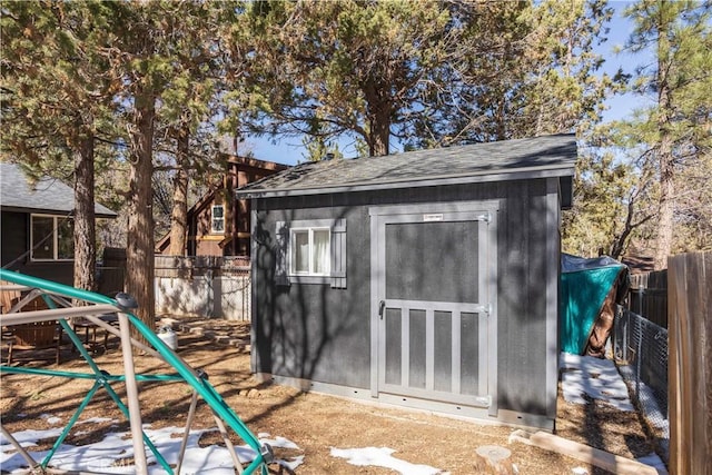 view of shed featuring a fenced backyard