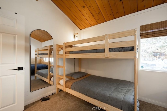 bedroom with carpet, wooden ceiling, lofted ceiling, and baseboards