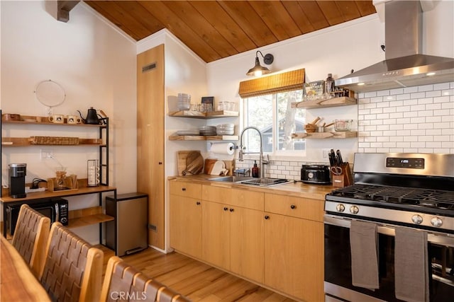 kitchen with open shelves, a sink, wall chimney range hood, wooden ceiling, and stainless steel gas range oven