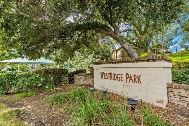 community sign featuring fence