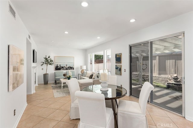 dining room with light tile patterned flooring, visible vents, and recessed lighting