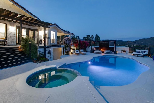 view of pool featuring stairway, a patio area, outdoor lounge area, and a pool with connected hot tub
