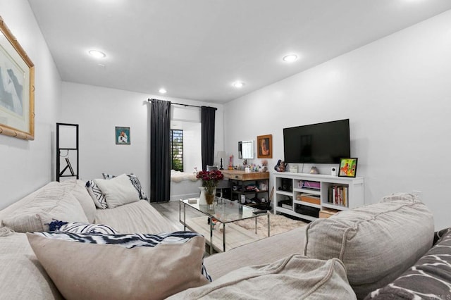living room featuring recessed lighting and wood finished floors