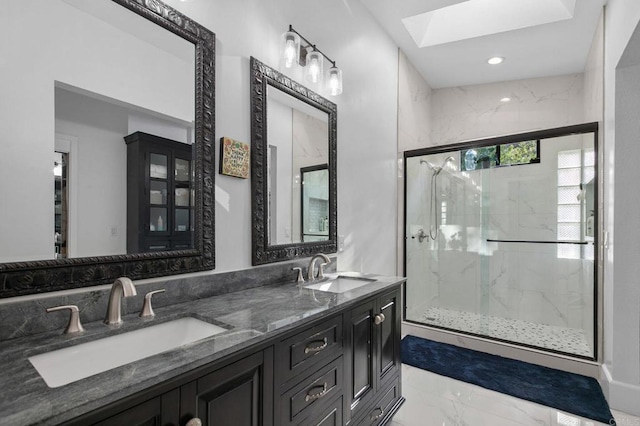 full bath with marble finish floor, a skylight, a marble finish shower, and a sink