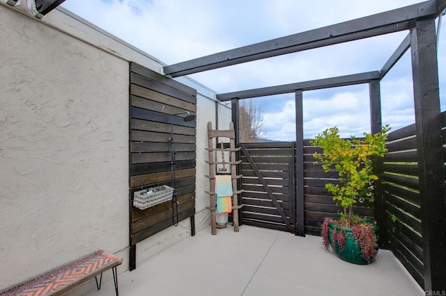 view of patio / terrace featuring fence
