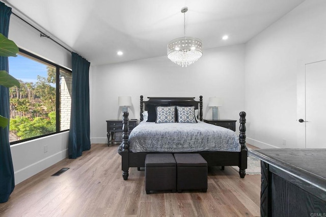 bedroom with baseboards, a notable chandelier, wood finished floors, and recessed lighting