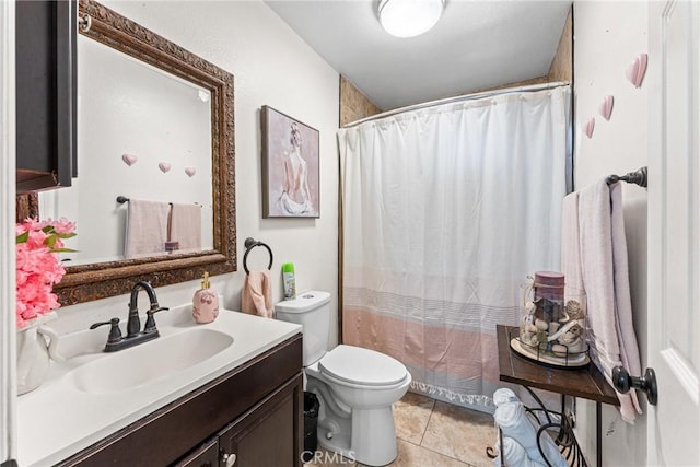 full bath featuring tile patterned flooring, curtained shower, vanity, and toilet