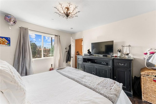 bedroom featuring wood finished floors