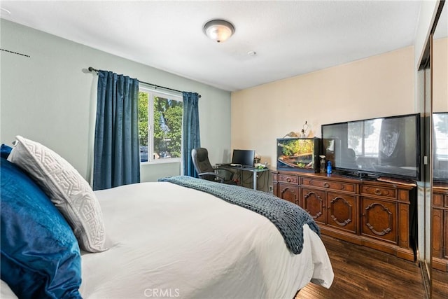 bedroom featuring wood finished floors