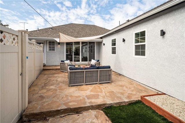 view of patio featuring fence and outdoor lounge area