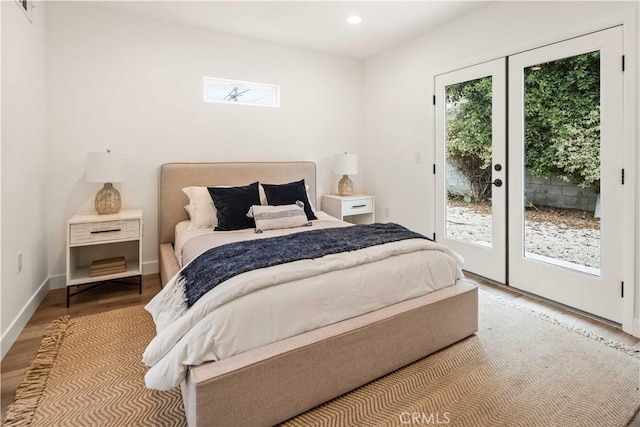 bedroom featuring french doors, recessed lighting, wood finished floors, access to outside, and baseboards