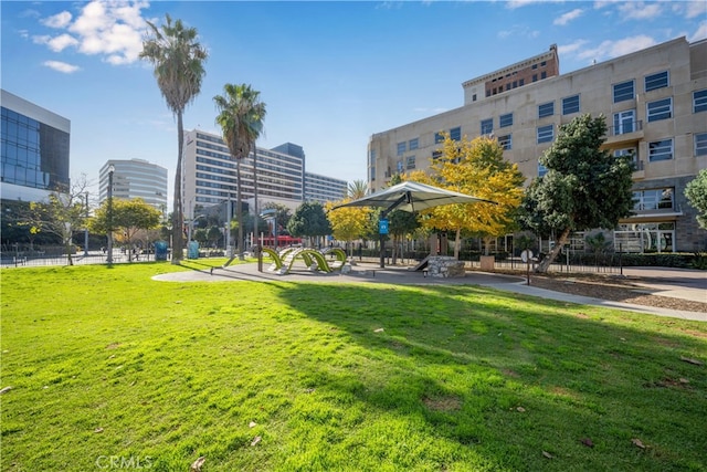 surrounding community featuring fence and a lawn