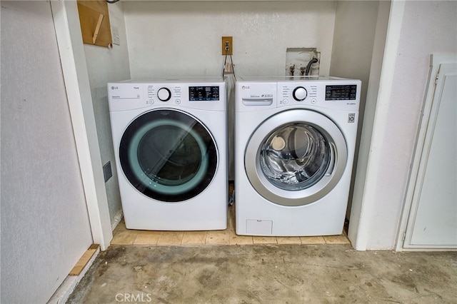 laundry area with laundry area and washer and clothes dryer