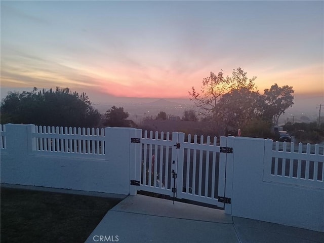 gate at dusk with fence