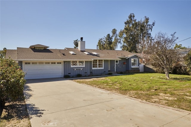 ranch-style house with concrete driveway, a chimney, an attached garage, board and batten siding, and a front yard