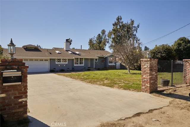 view of front of property with a garage, fence, driveway, a front lawn, and board and batten siding