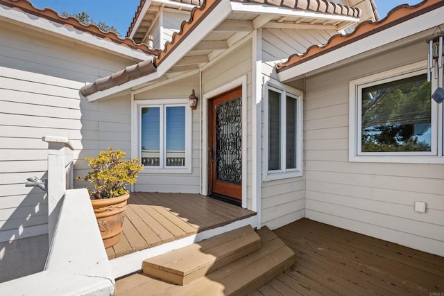 entrance to property with a tile roof