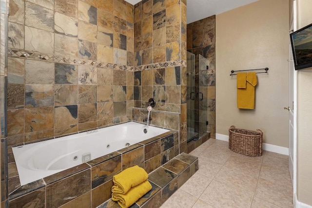 bathroom with a whirlpool tub, baseboards, a shower stall, and tile patterned floors