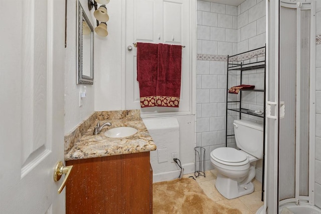 full bath with tile patterned flooring, vanity, and toilet