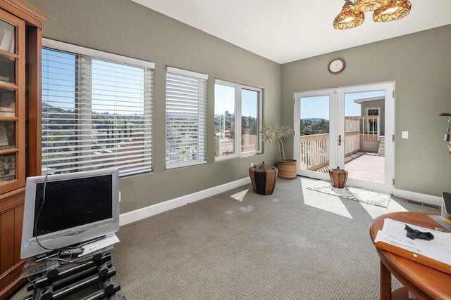 workout area featuring carpet, baseboards, and french doors