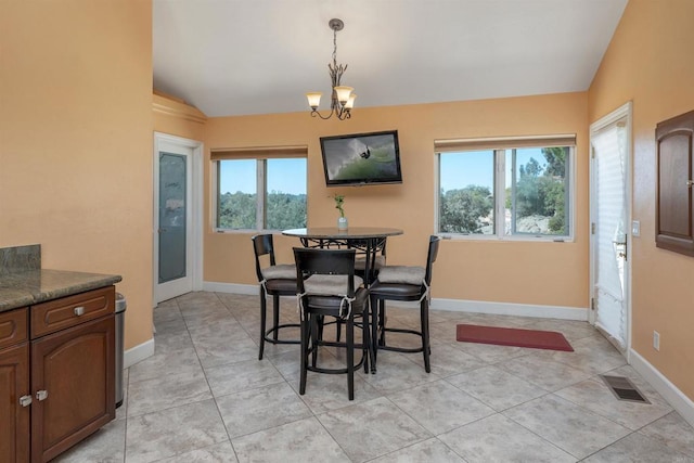 dining room featuring vaulted ceiling, baseboards, visible vents, and an inviting chandelier