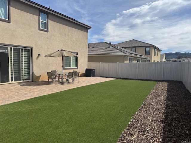 view of yard with a patio area and a fenced backyard