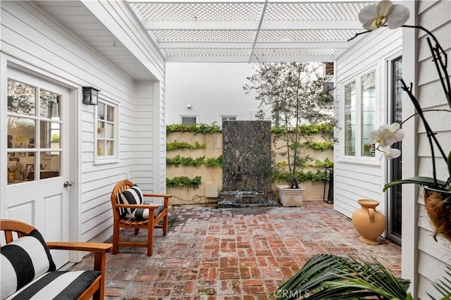 view of patio / terrace with fence and a pergola