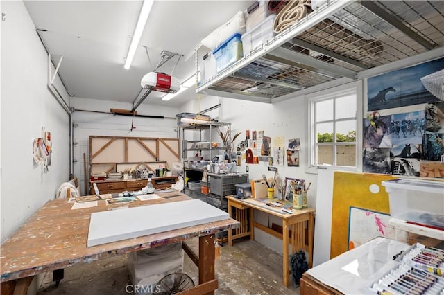 garage featuring a workshop area and a garage door opener