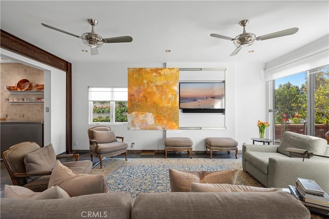 living area featuring a ceiling fan