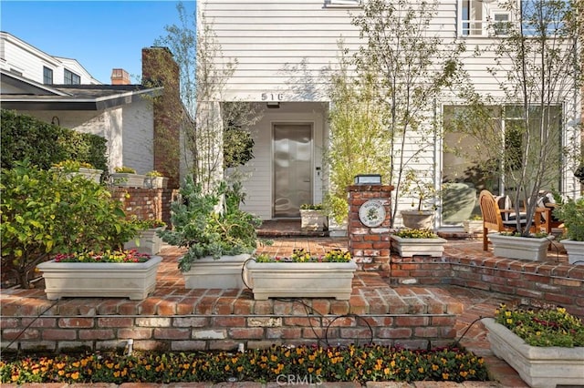 doorway to property featuring a patio