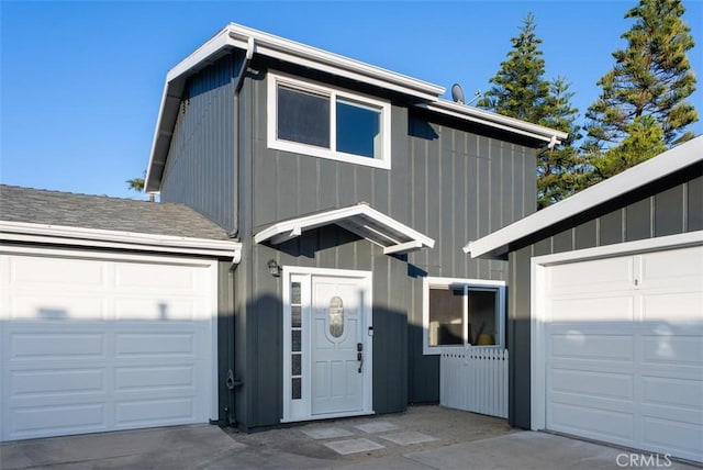 garage with concrete driveway